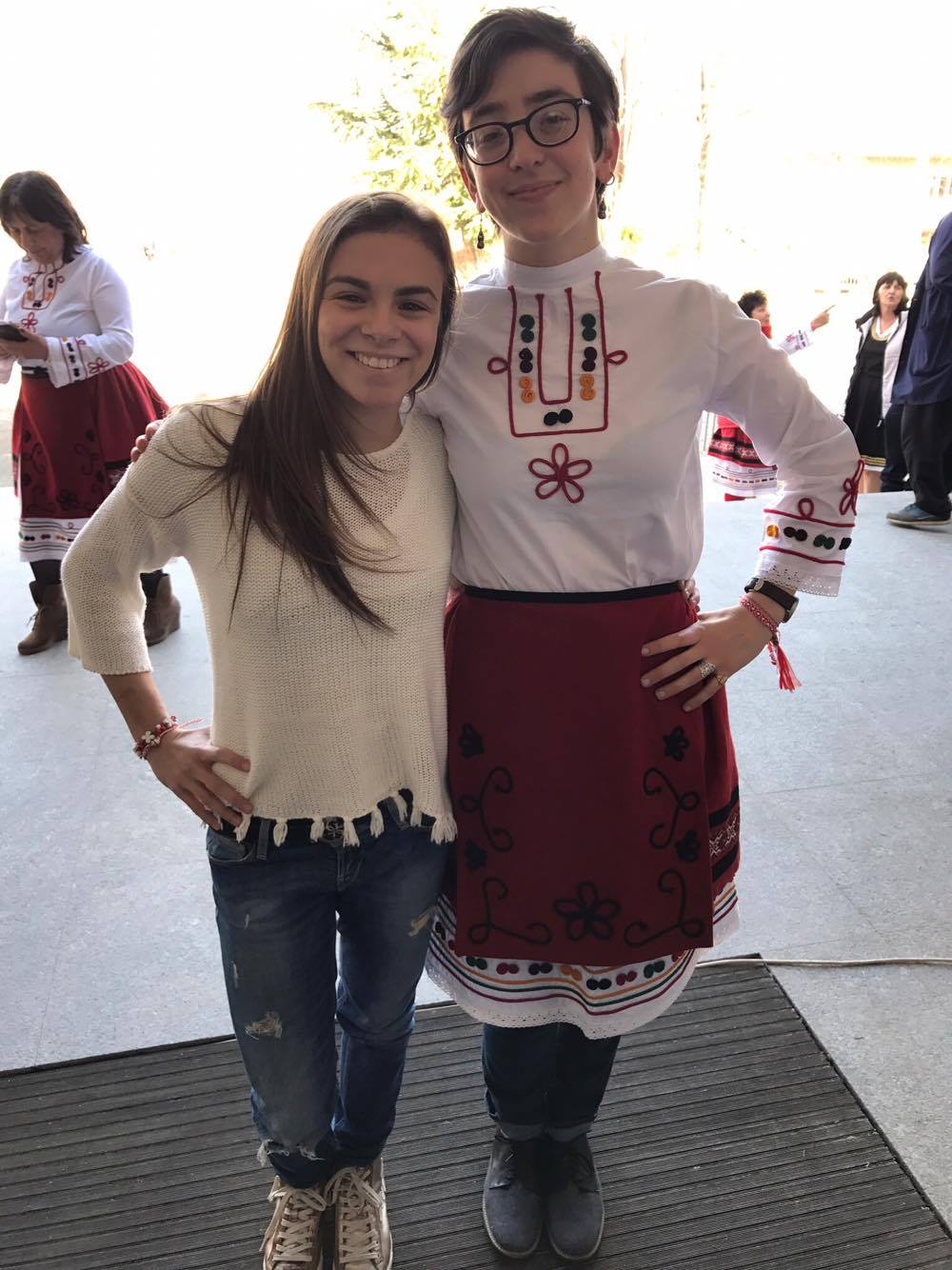 Hannah, in traditional Bulgarian dress, poses with a friend 