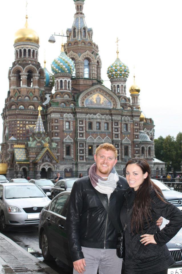 Chris and a study abroad friend pose in front of a Russian building