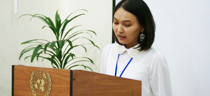 Kyrgyz Alumna in front of Podium