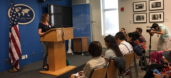 Azat Ruziev, 2014 FLEX alumnus, films a presentation at the Foreign Press Center.