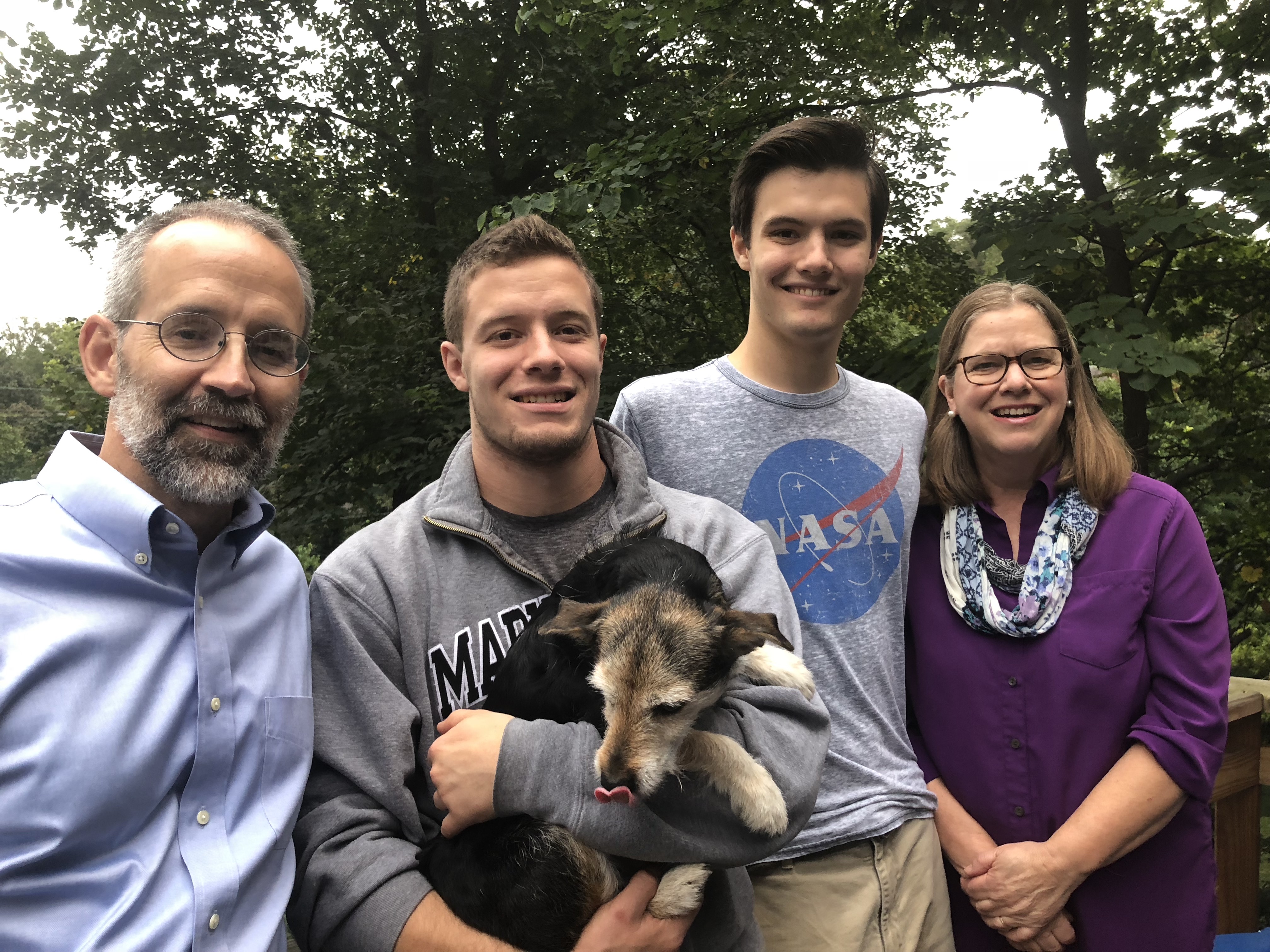 The Spawn family (and pup!) are all smiles for the camera. Son Kyle and mother Carla are pictured on the right.