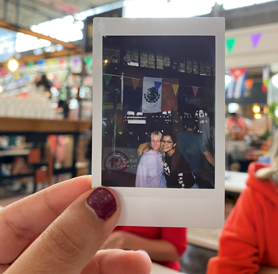 Alynn Jimenez holding polaroid picture