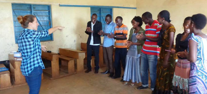 Rebecca (far left) leads a team building game with The Ota Initiative staff during a group leader training seminar