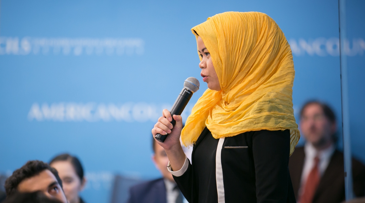Professional fellow from Indonesia speaks to her peers