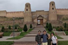 Students on the summer Eurasian program posing in front of a castle