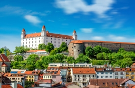 View on Bratislava castle on the green hill with old houses at the bottom from the Michael's watch tower in Slovakia