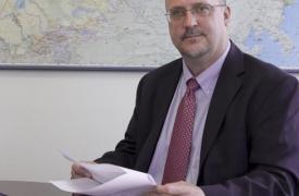 Dr. David Patton sits at desk