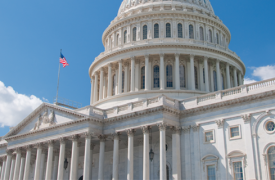 DC's Capitol building against a bright blue sky