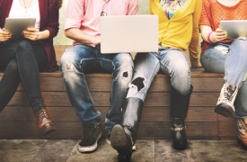 A stock image of young people using laptops