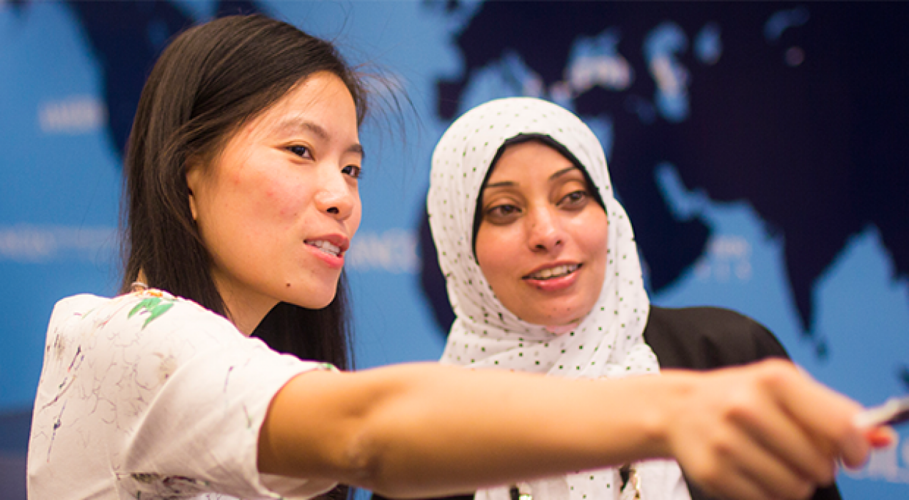 Two female teachers discussing TCLP teaching methods