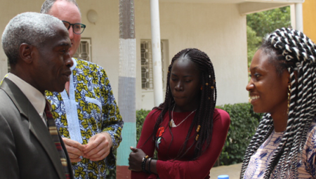 US Ambassador to Senegal, Dr. Tulinabo Mushingi, speaks with students.