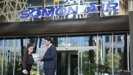 Two people look at a piece of paper