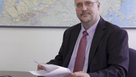 Dr. David Patton sits at desk