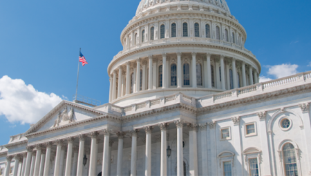 DC's Capitol building against a bright blue sky